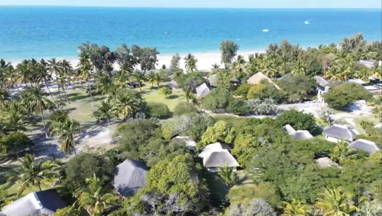 Bon Espoir from the air — thatch roofs in the palms on the beachfront