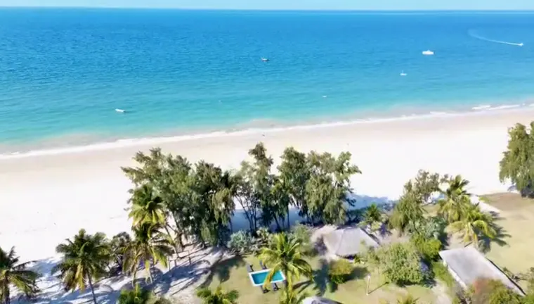 The beachfront and pool from above