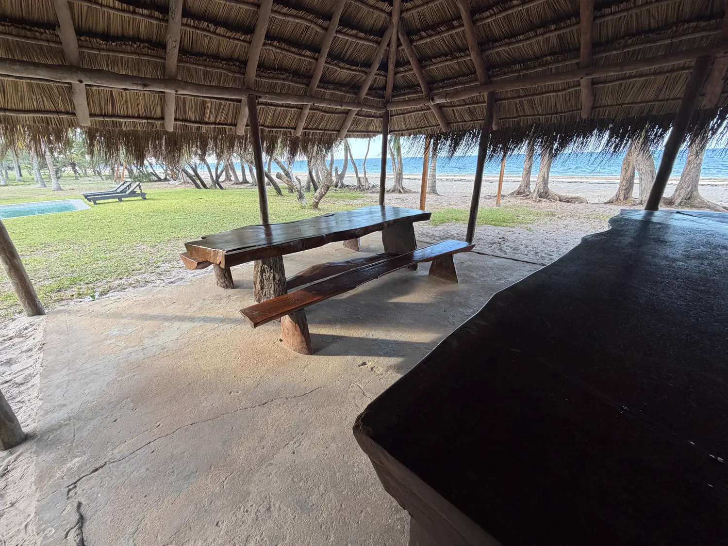 Benches under the beach bar lapa, looking onto the sand