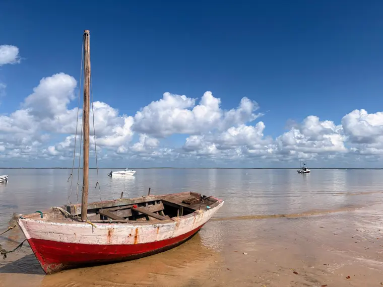 A dhow at anchor on the glassy flats
