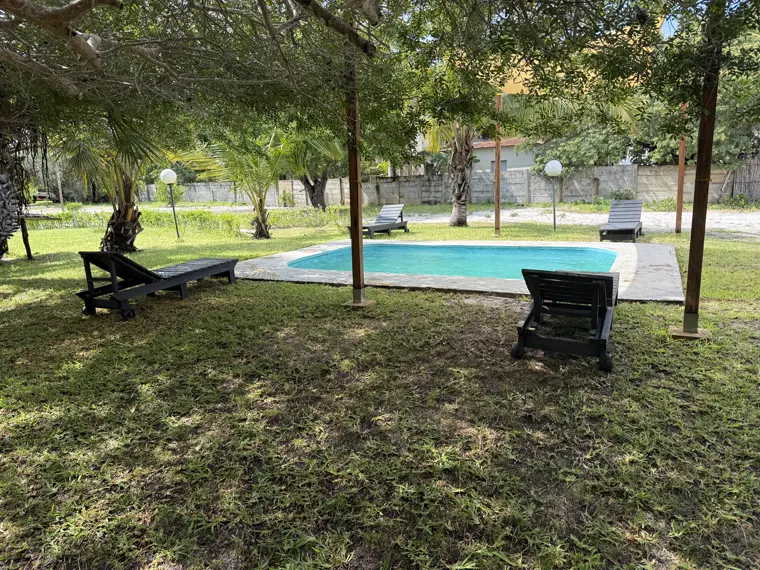 Loungers by the pool near the camp