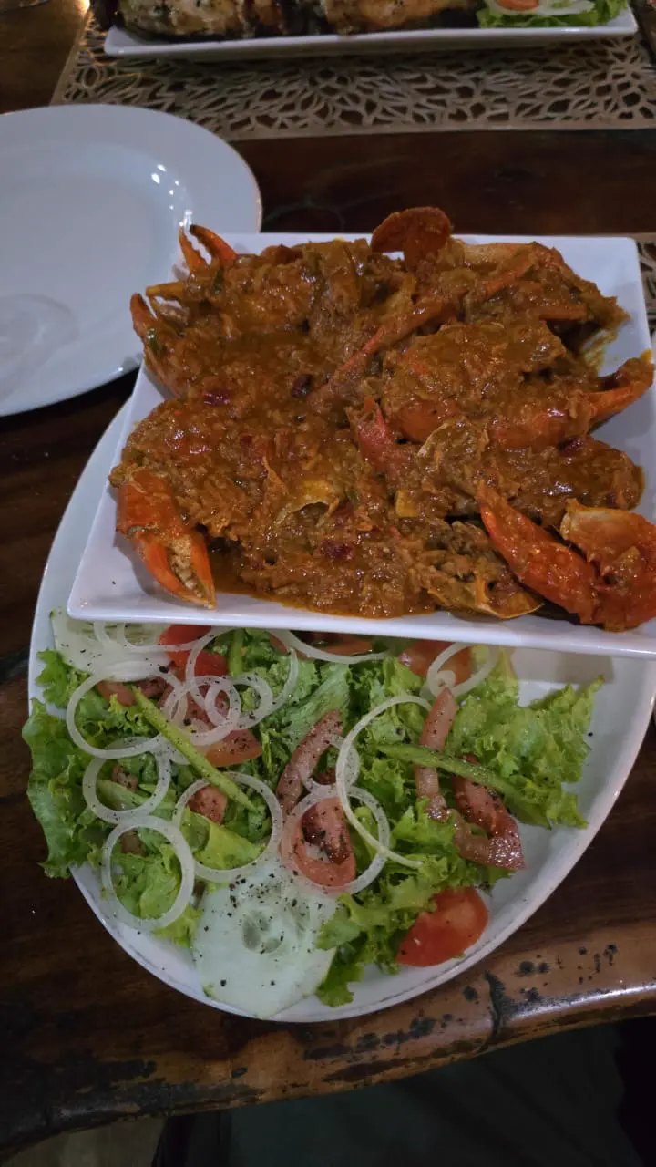 Crab curry served with fresh salad