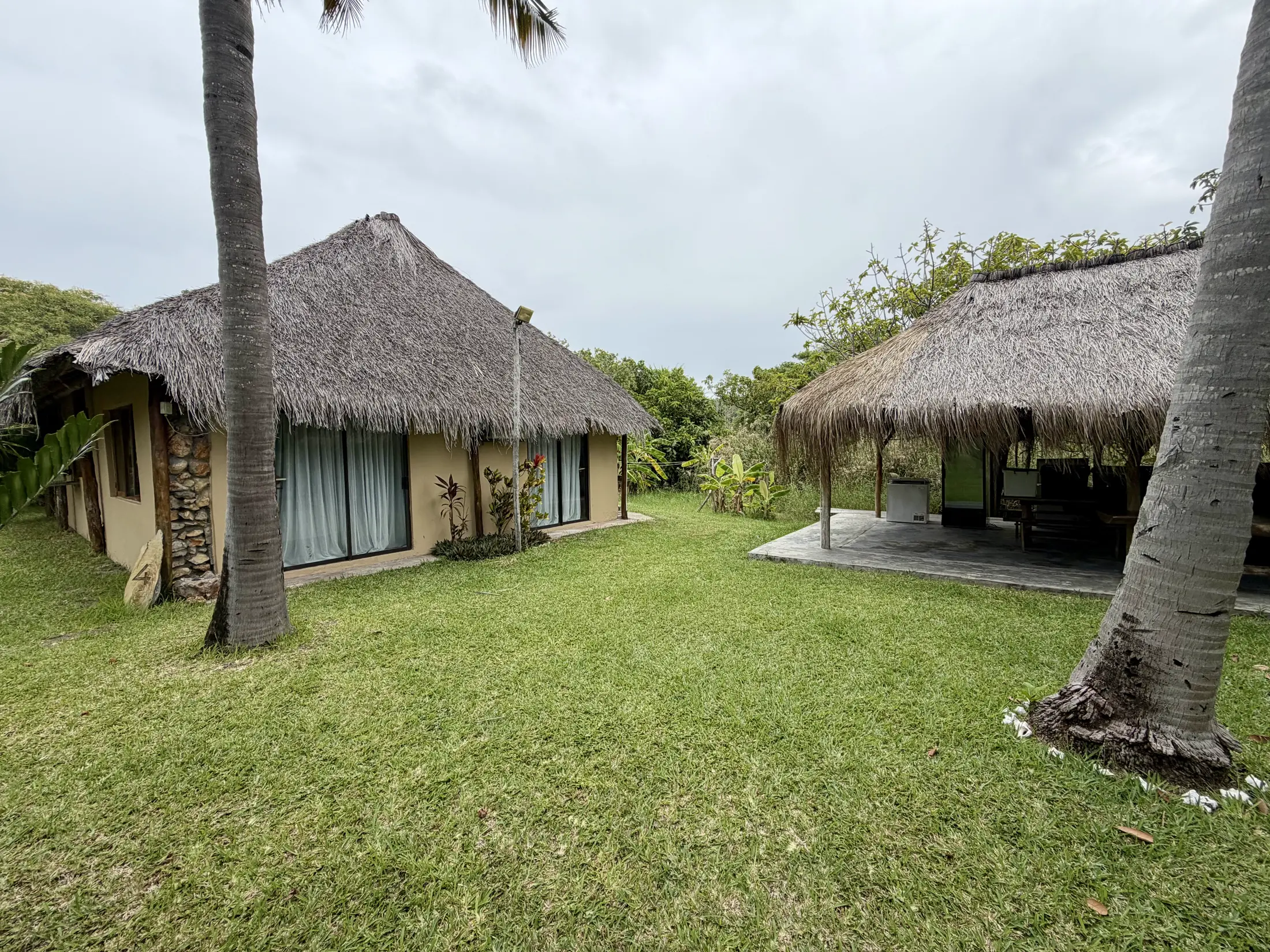 The thatched casas under the palms at Bon Espoir