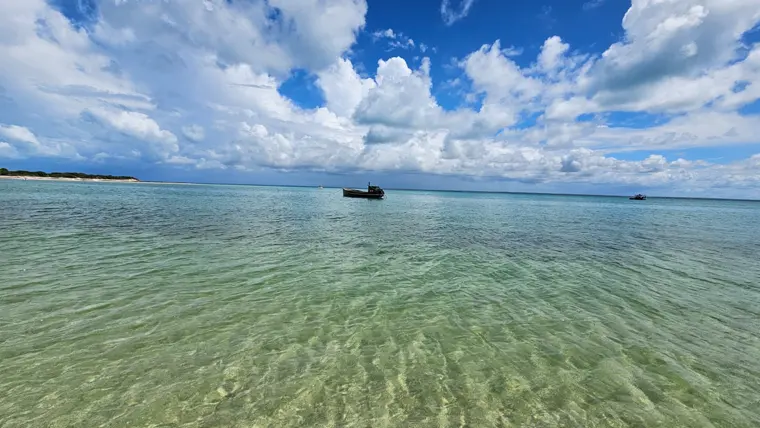 Clear shallows off the island