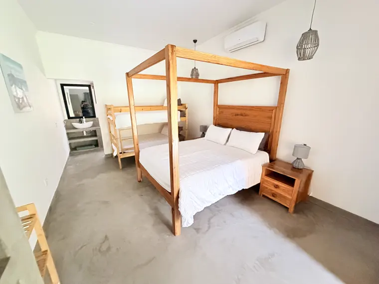 Room One with its timber four-poster bed