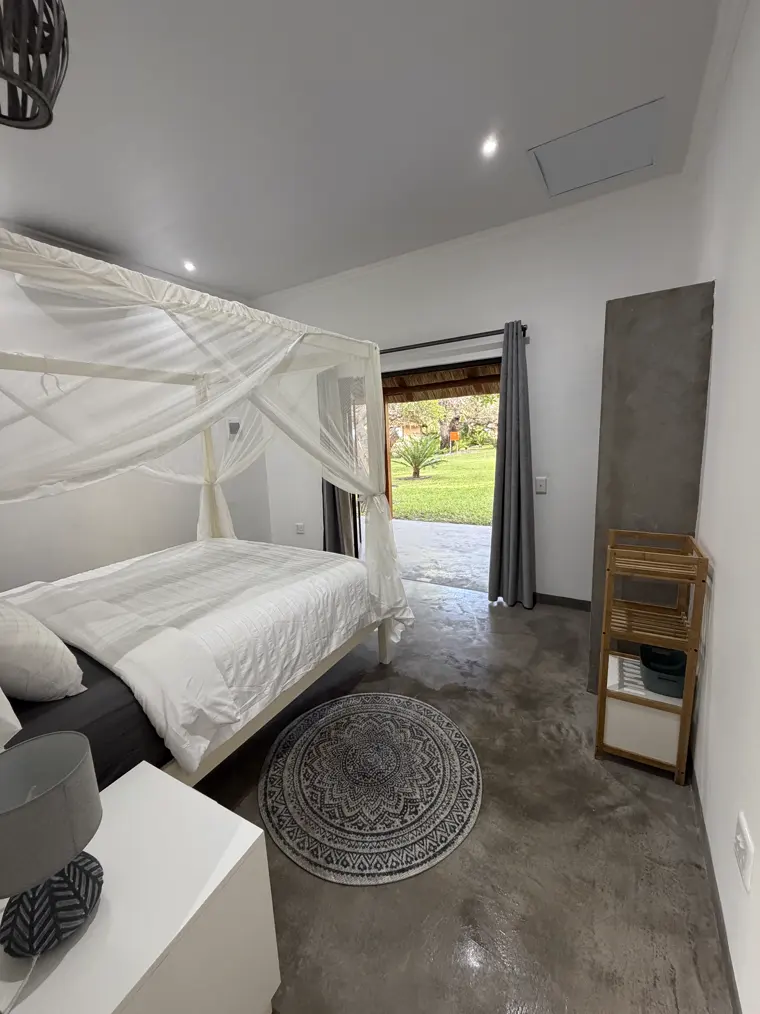 Room Three with the door open to the garden