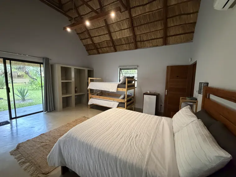 Room Five under the high thatch ceiling