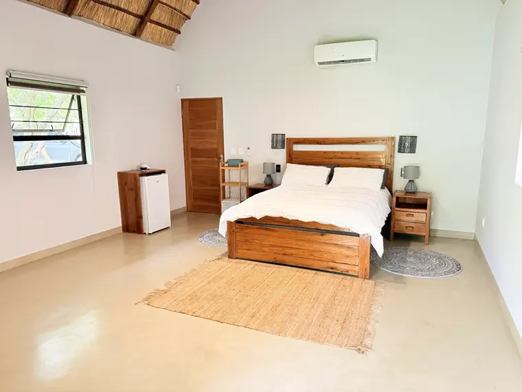 The timber double bed in Room Five