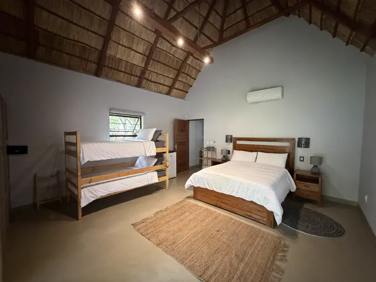 The bunks and bed in Room Five