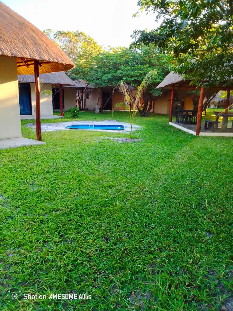 The lawns, pool and lapa at the sala community area