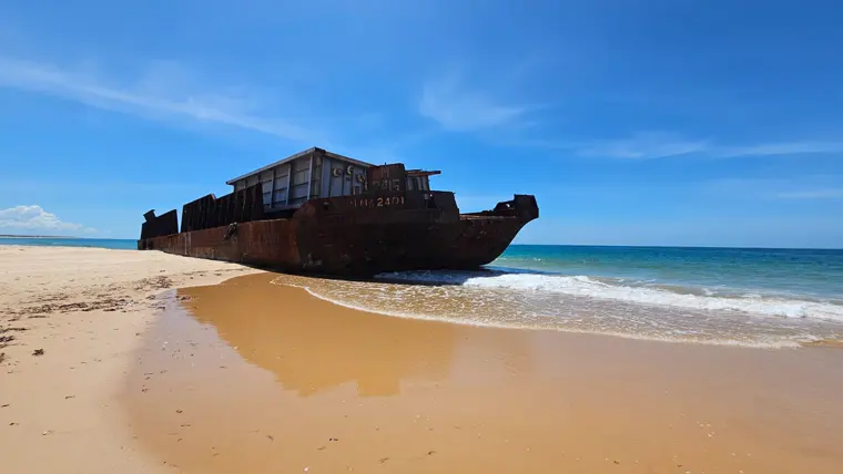 A barge resting in the shallows